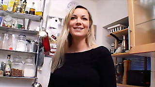 Outstanding German MILF with huge boobs dildoing her shaved muff in the kitchen